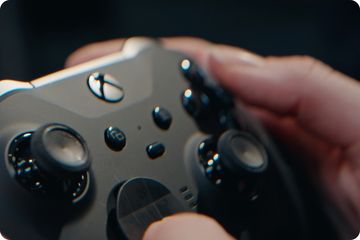 Hands holding an Xbox controller