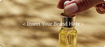 Hand holding a golden beauty serum bottle with a placeholder brand label