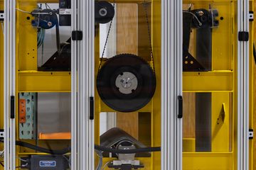 TREW Automation roller test platform with a yellow frame