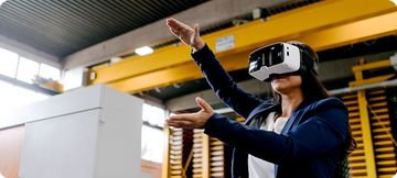 Woman using a virtual reality headset in an industrial space